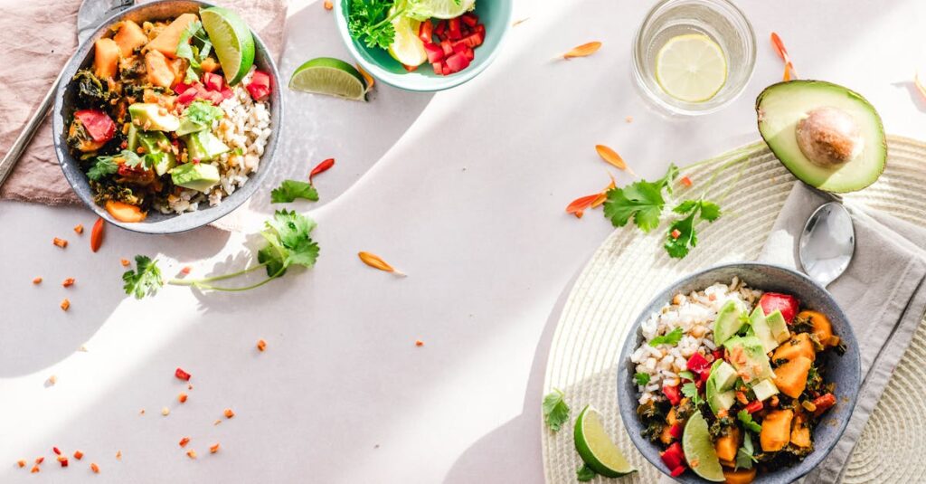 Top-down view of vibrant vegan bowls filled with fresh vegetables, perfect for a healthy meal.